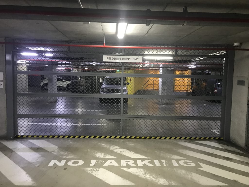 Drive down the 2nd ramp, turn left then immediately turn right and drive towards the internal roller door.