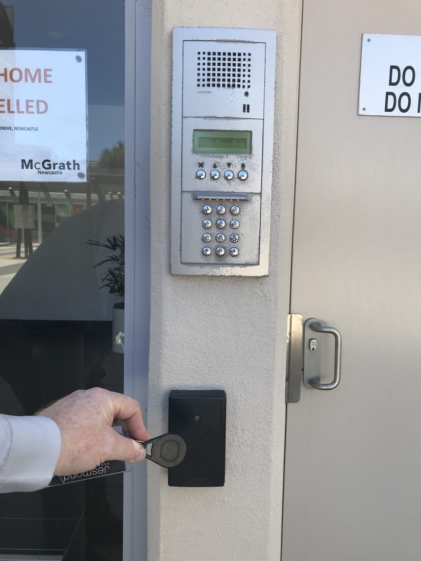 Swipe the black proximity card up against the proximity reader and open the glass foyer door Swipe the black proximity card up against the proximity reader and open the glass foyer door