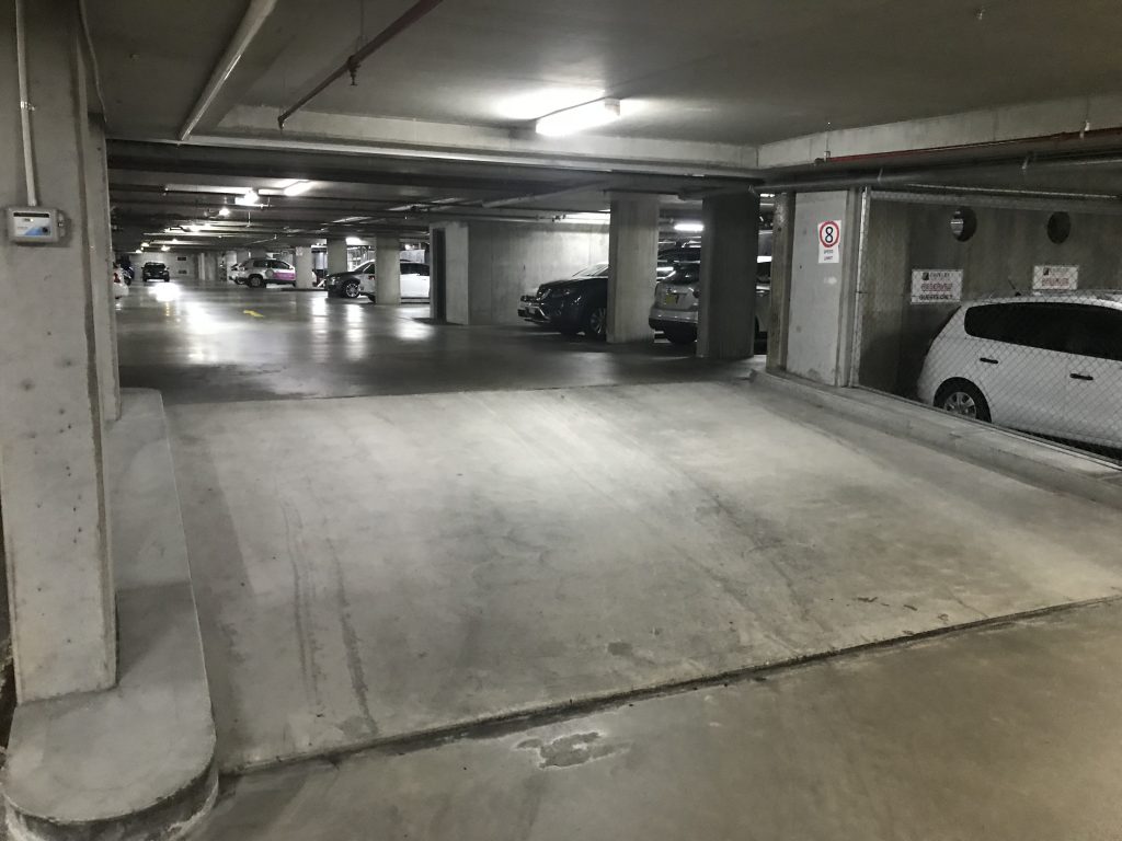 Turn left and drive up the ramp heading in an Easterly direction