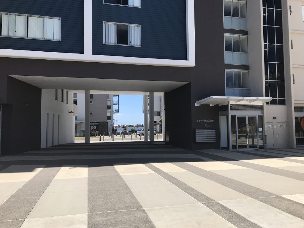 Walk past the opening on the left hand side between the two tower